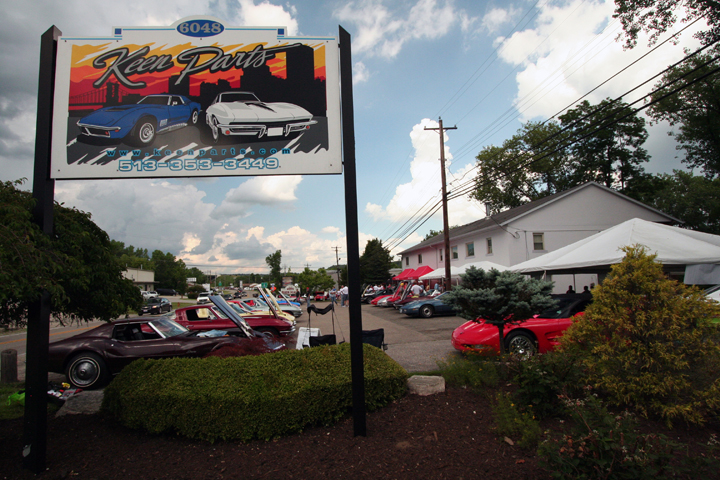 Photo of Keen Parts storefront courtesy with Corvettes parked in parking lot in front of building